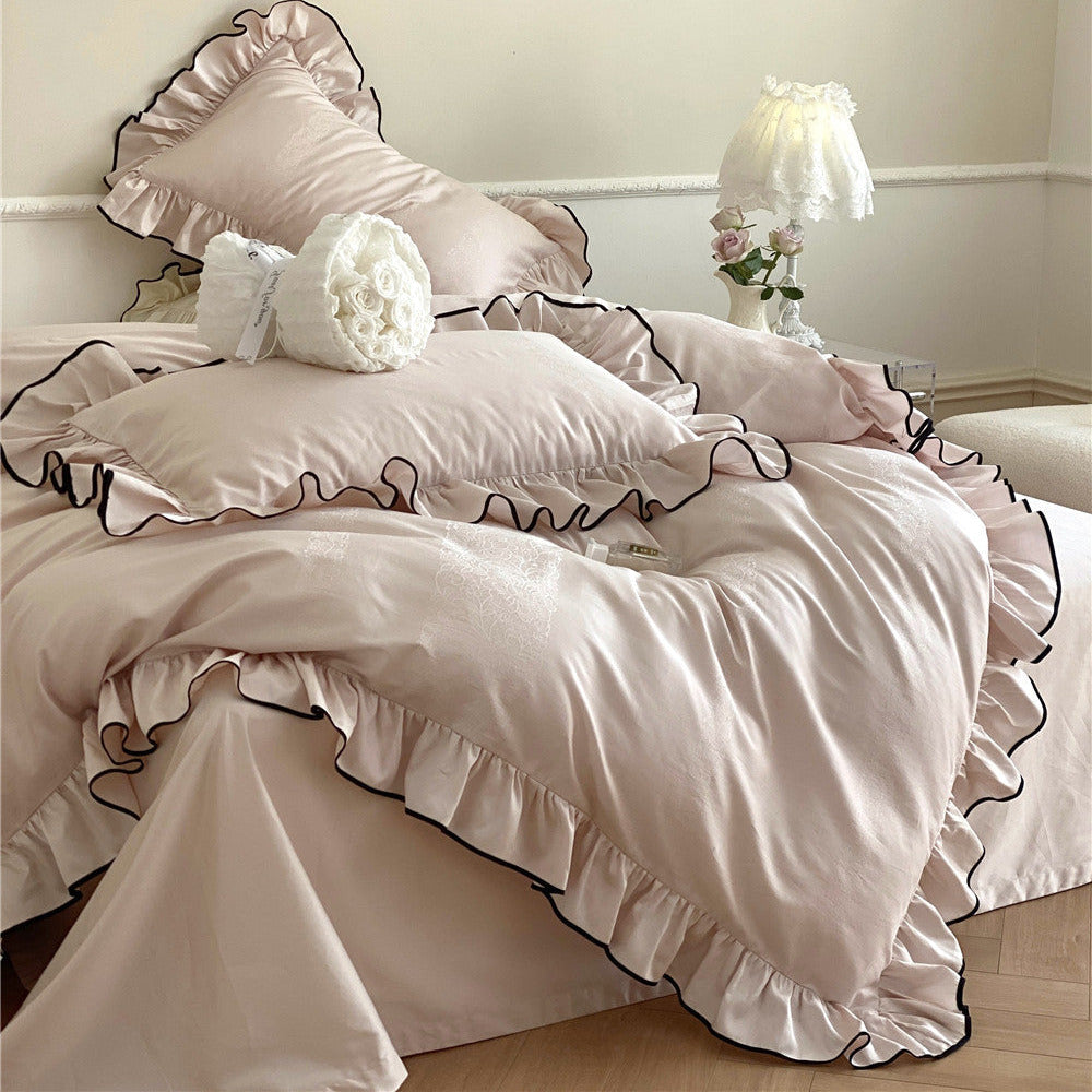 Blush pink bedding set with jacquard pattern and black edge ruffles