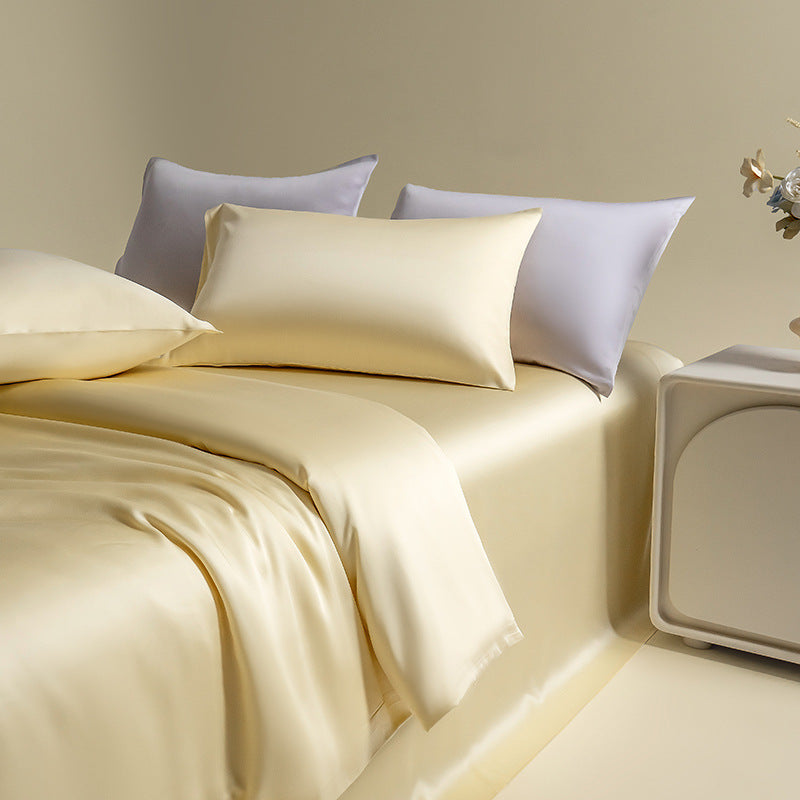 Silky Lyocell twin bedding set in a buttery yellow, complemented by matching colored pillows, for a bright and cheerful space.
