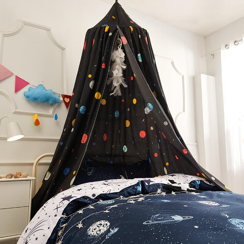 Black bed canopy for boys featuring colorful planets and constellations, paired with space-themed bedding.