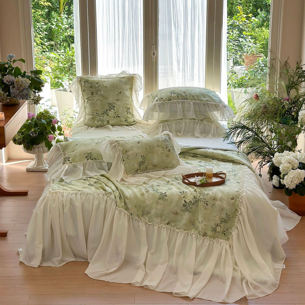 Green ruffled comforter in natural light bedroom