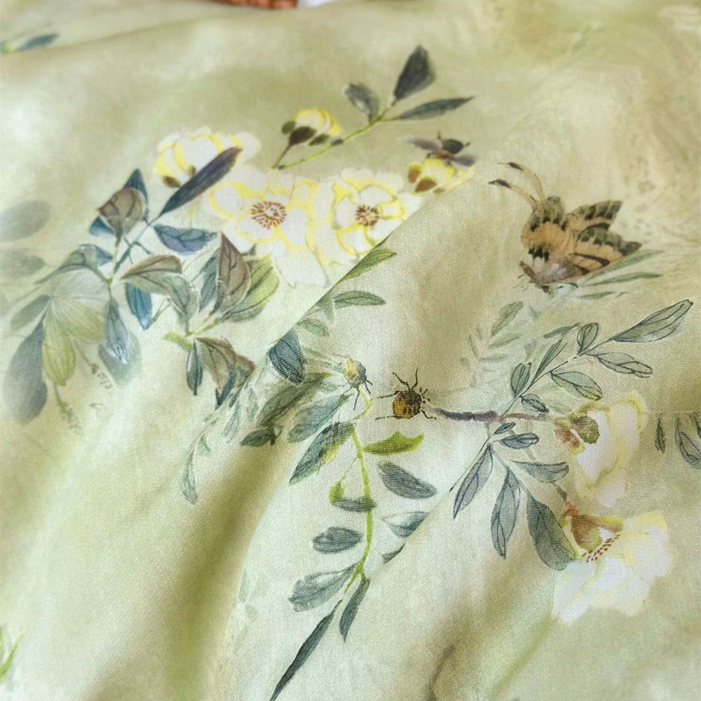 Botanical print detail with butterfly on green TENCEL comforter