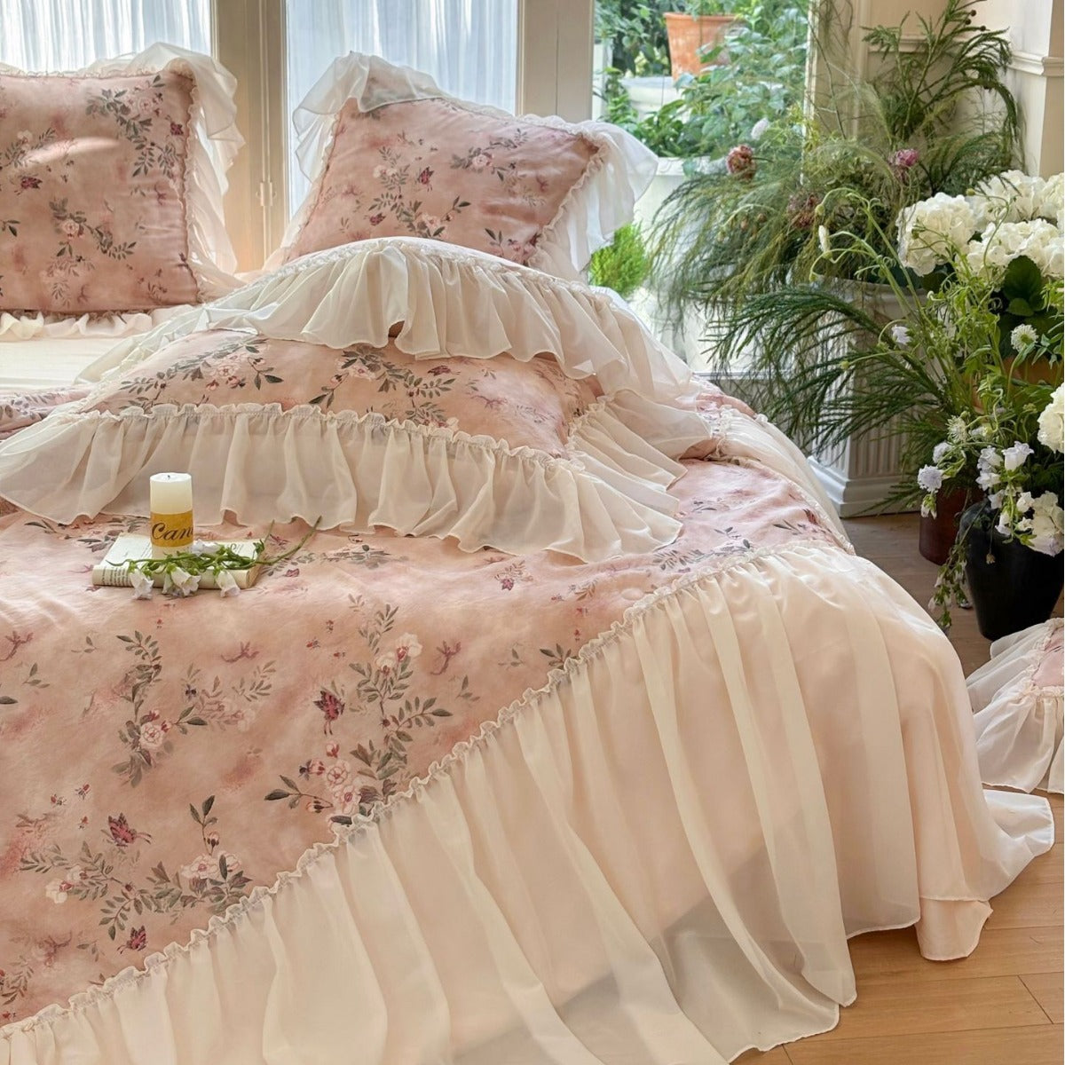 Close-up of pink comforter with floral print and ruffles