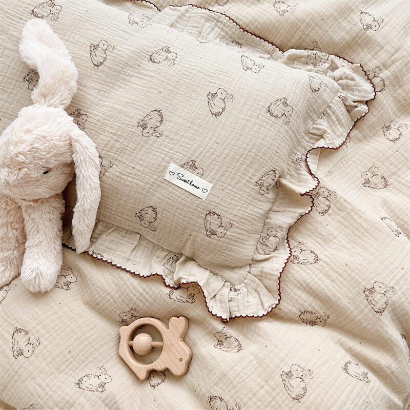 Close-up of bunny print pillowcase with ruffled trim