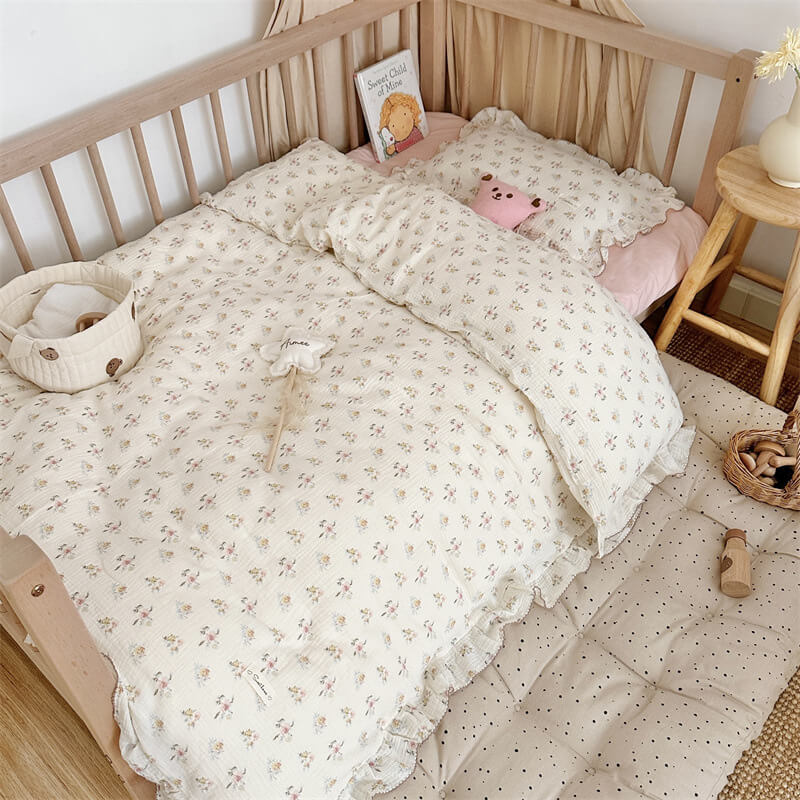 Toddler bed with azalea floral duvet cover and ruffled pillowcase