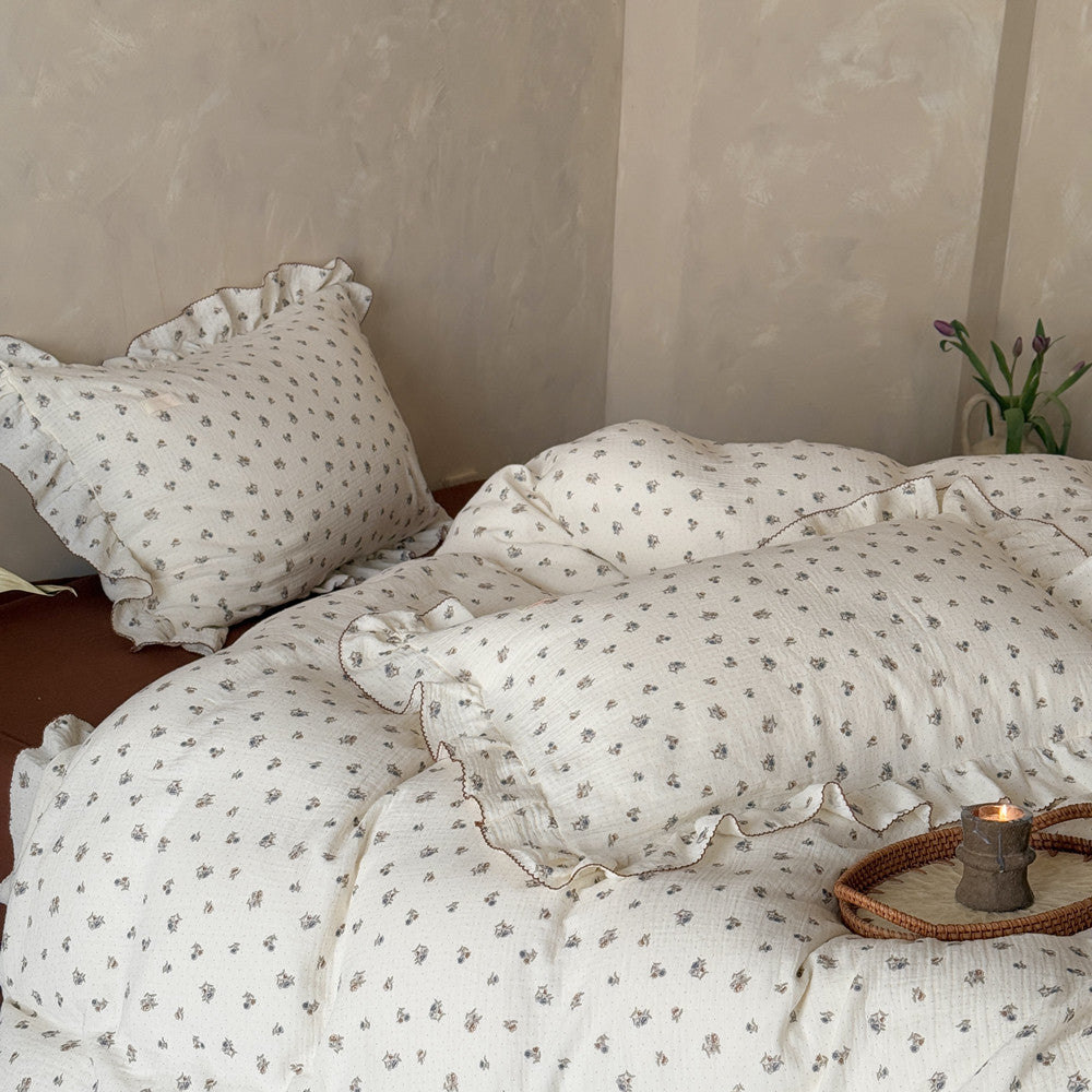 Floral cotton bedding set styled with rustic decor and brown flat sheet
