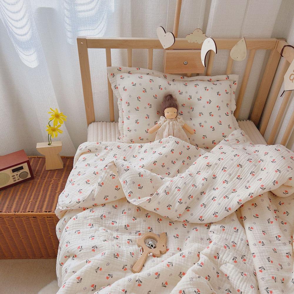 Muslin baby comforter with vintage orange floral print