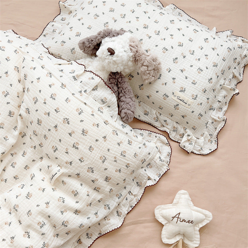 Rose floral duvet cover and pillowcase on bed in girls’ room