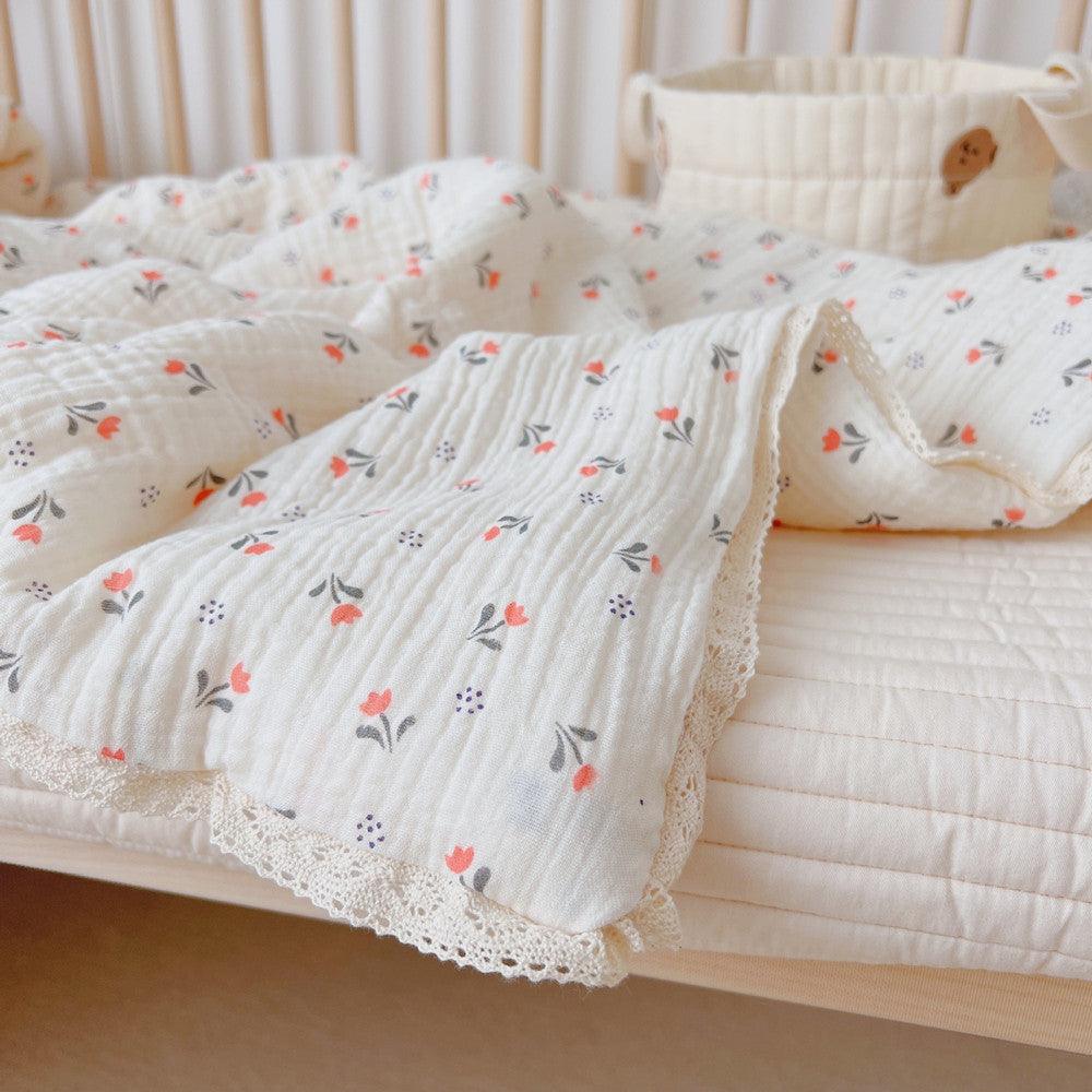close-up of Toddler quilt with pillow – vintage muslin floral bedding