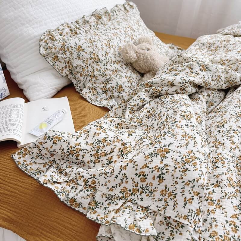 Hibiscus floral ruffle duvet cover set on bed with ruffled pillow