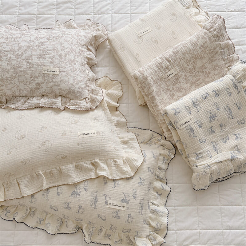 Assorted animal theme ruffle duvet covers in cotton muslin, displayed together for kids’ bedding