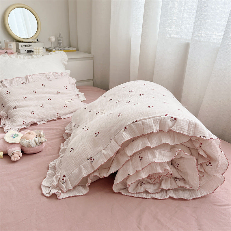 Soft pink cherry duvet cover and pillowcase on twin bed