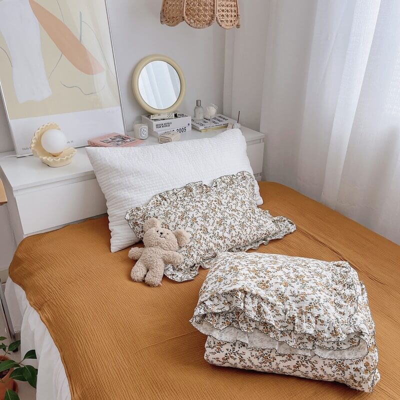 Ruffled pillowcase with hibiscus floral print and soft muslin fabric