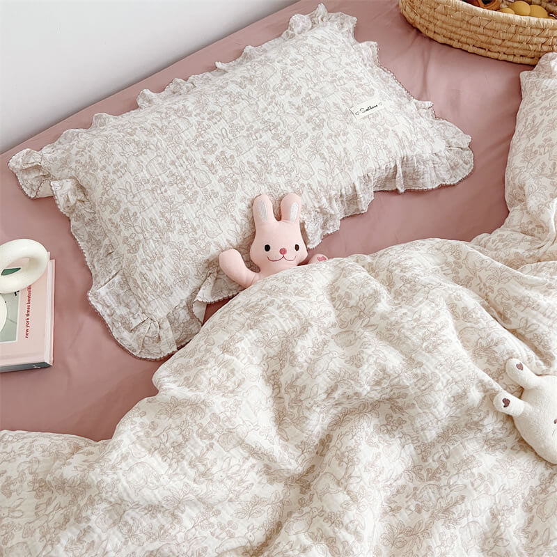 Ruffled cotton muslin woodland duvet cover and pillowcase set with taupe bunny print on pink bed