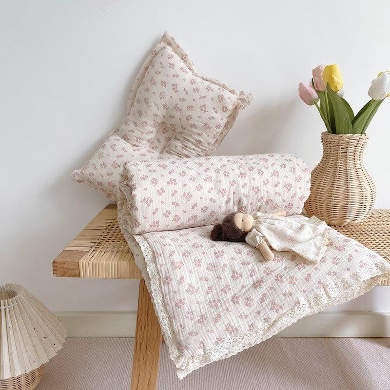 Muslin floral baby comforter with lace trim