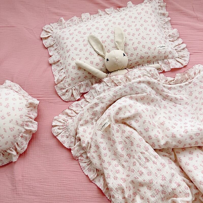 Ruffled floral pillowcase in carmine pink floral print on soft muslin fabric