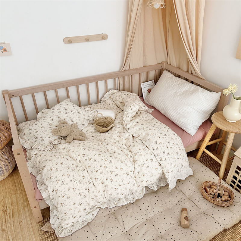 Kids’ room with violet floral ruffle duvet cover set, pink sheet, and neutral decor