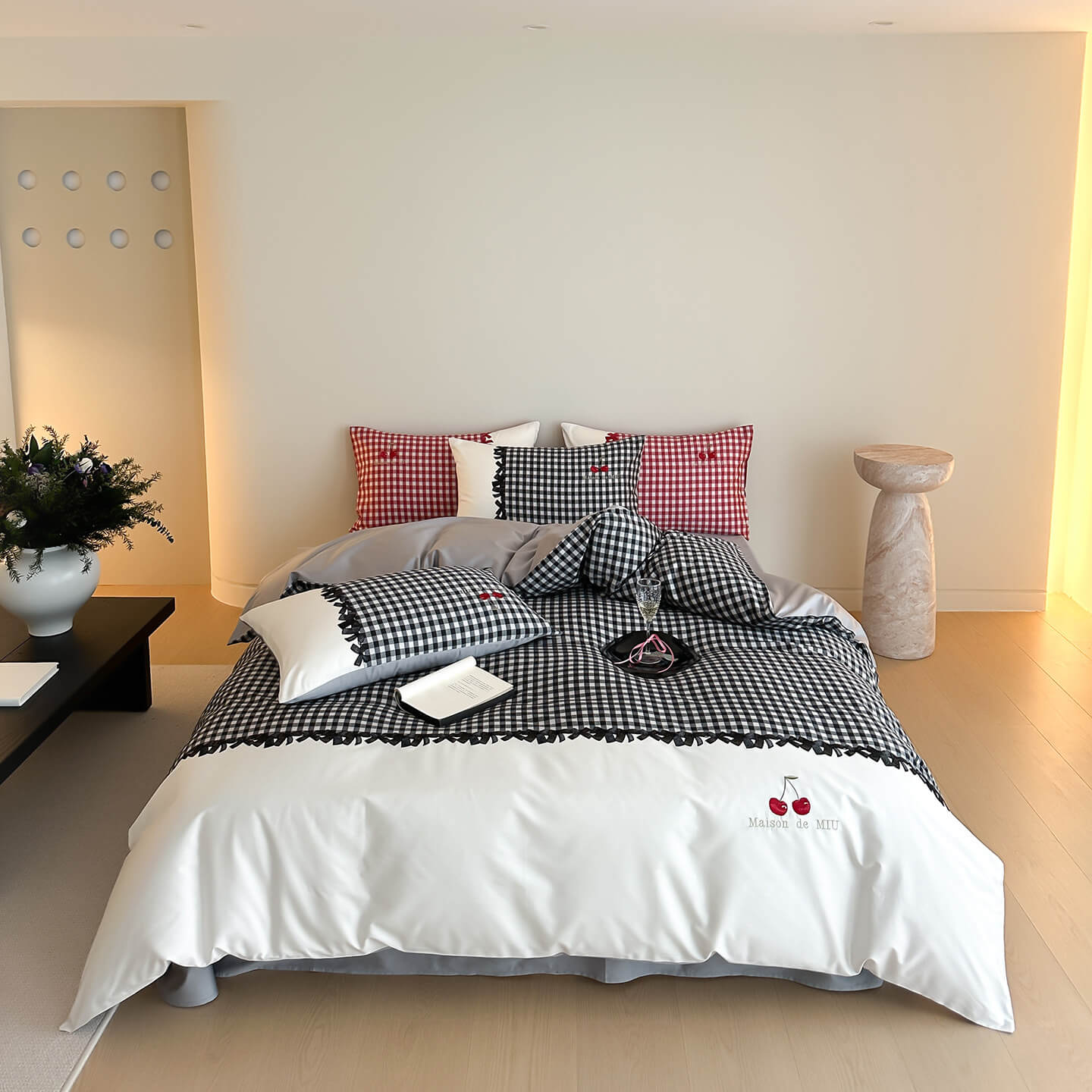 Bedroom with checkered bedding and decorative pillows