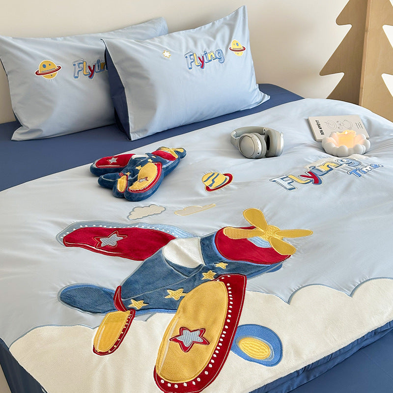 Children's airplane-themed bedding set with pillows and toys on a bed.