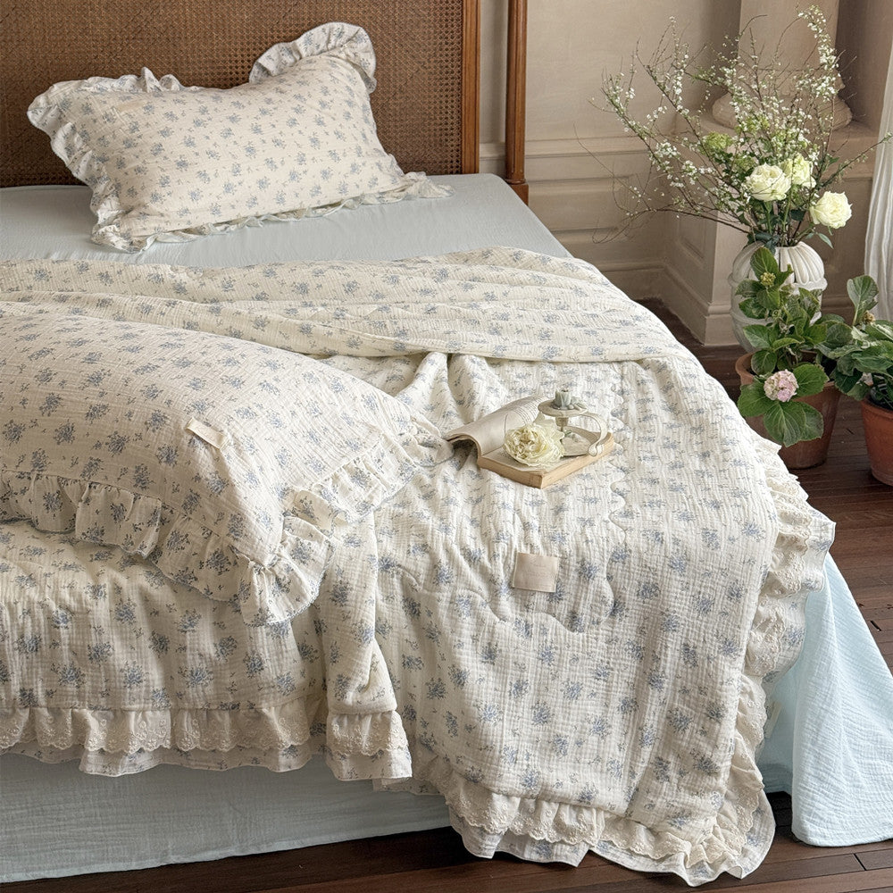 Full bed view with blue floral cotton comforter and matching pillowcase