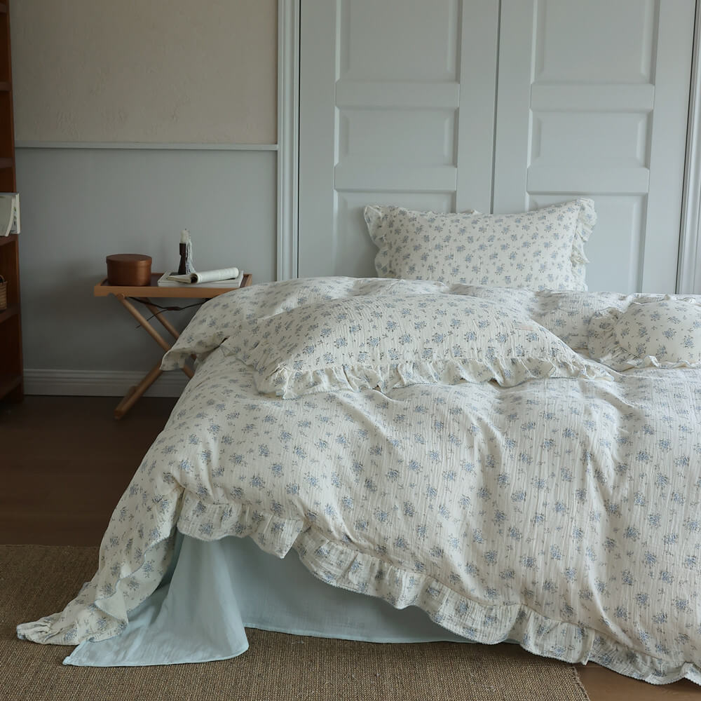 Full bed view of Blue Posy Duvet Cover Set with ruffled cotton muslin and soft blue floral print