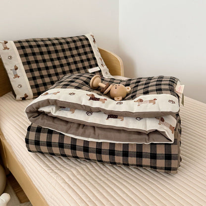 Children's bedding set with checkered pattern on a bed