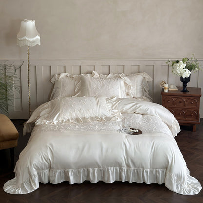 Full view of the cream Butterfly Embroidered Bedding Set with dramatic ruffles.