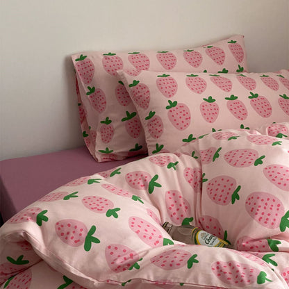 Close view of pink strawberry cotton jersey bedding with matching pillowcases