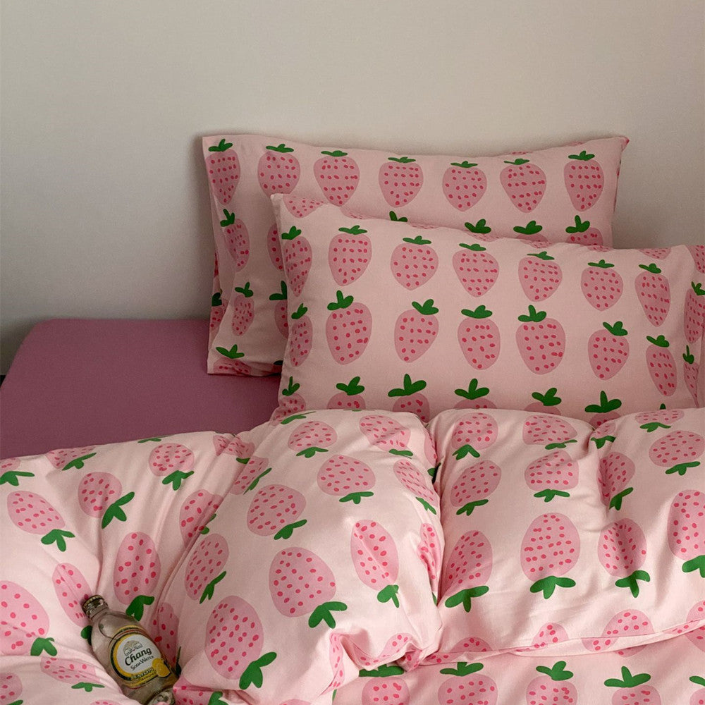 Matching strawberry pillowcases and duvet cover in pink cotton jersey bedding set