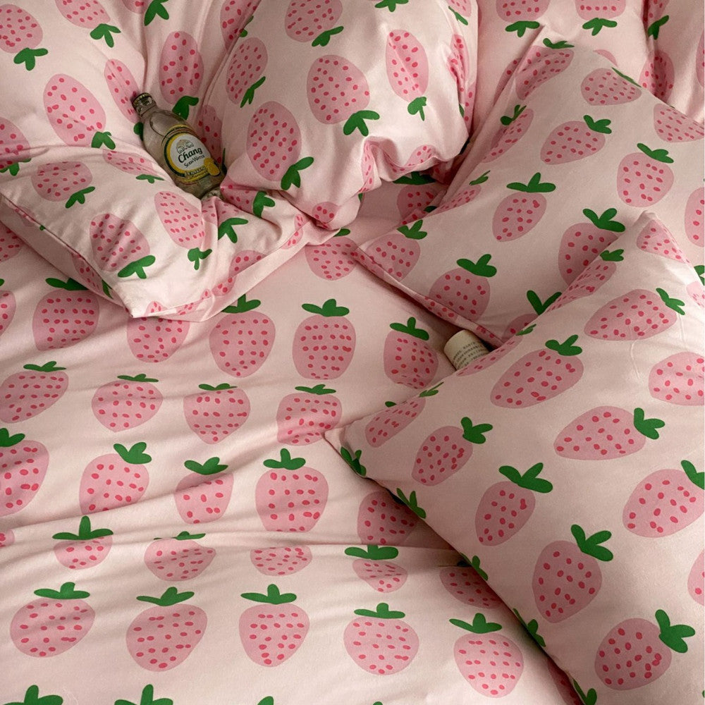 Strawberry pattern detail on soft pink cotton jersey bedding set