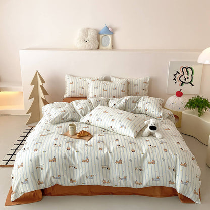 Dachshund stripe kids bedding set in cotton muslin with blue stripes, dog pattern, rust flat sheet, and playful kids room styling