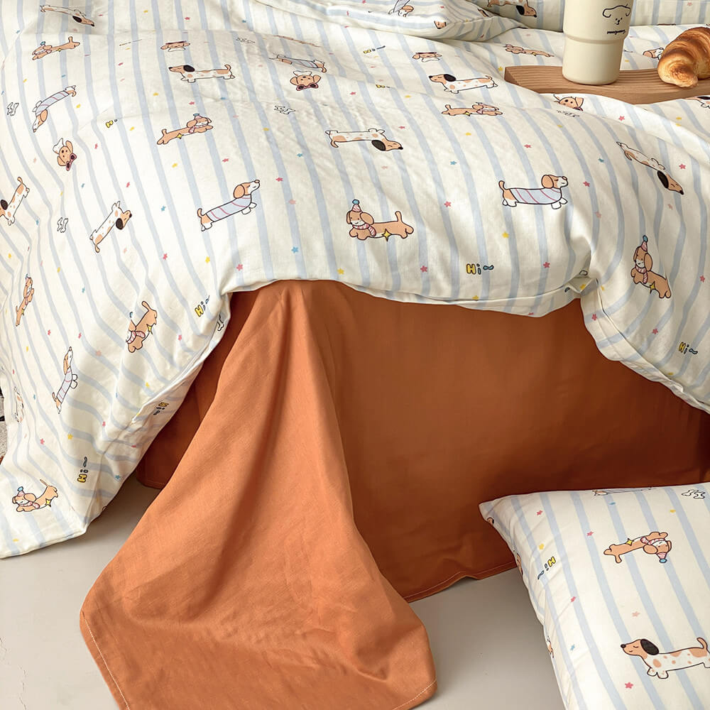 Dachshund stripe bedding set with warm rust flat sheet, matching pillowcase, and cotton muslin duvet cover detail