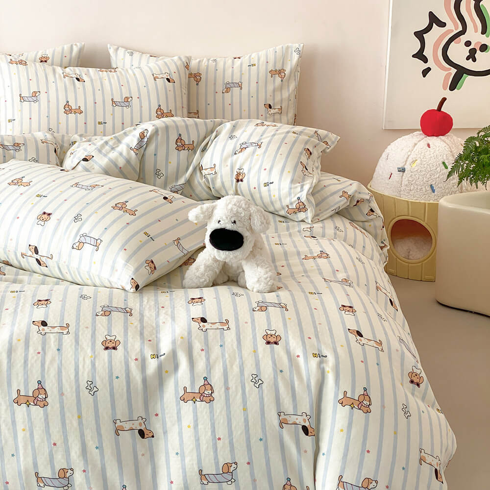 Playful dog themed kids bedding set with dachshund pattern, blue stripes, plush dog toy, and cheerful room decor