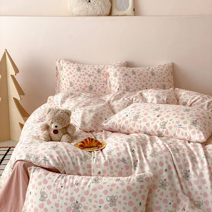 Pink elephant kids bedding set styled in a pastel children’s room with matching pillows and playful wall decor