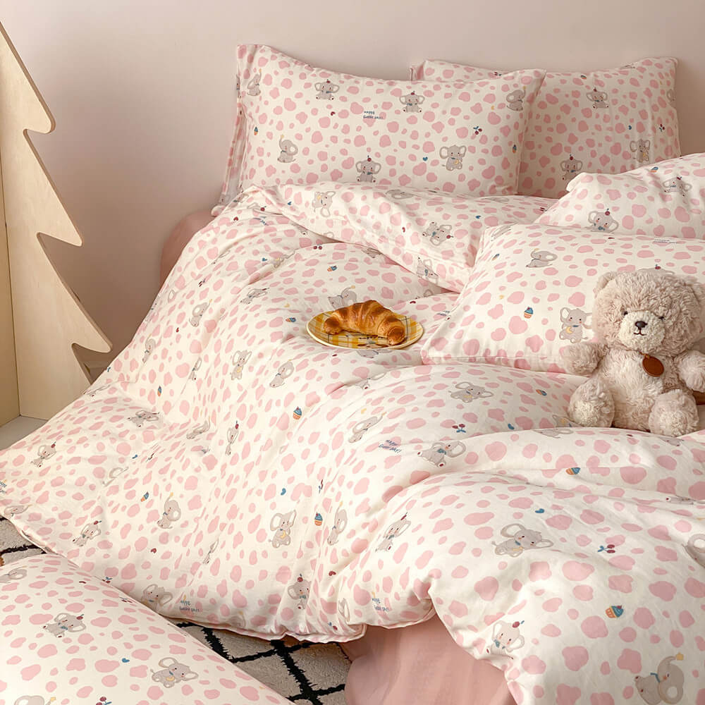 Cute pink elephant bedding set with cotton muslin duvet cover, plush teddy bear, and soft kids room decor