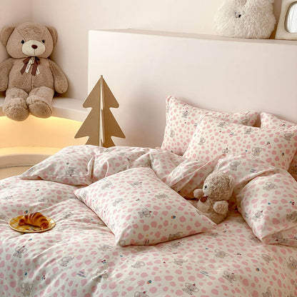 Full view of pink elephant kids bedding set with matching pillowcases, blush sheet, and cozy cotton muslin texture