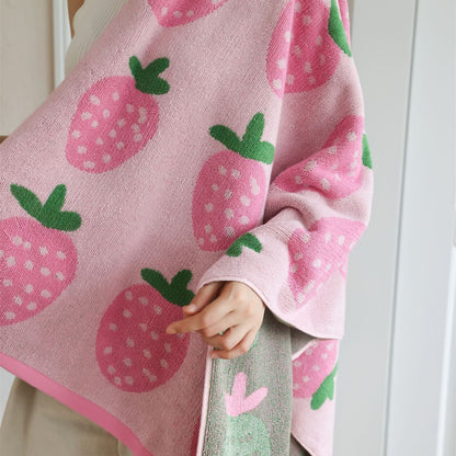 Pink strawberry bath towel showing cotton terry texture and green leaf pattern
