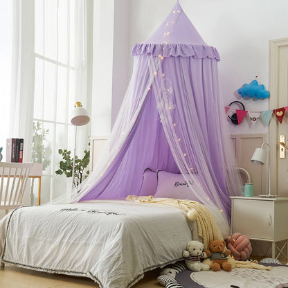 Wide view of a purple double-layer kids bed canopy over a white bed, styled as nursery room decor with a floor mat