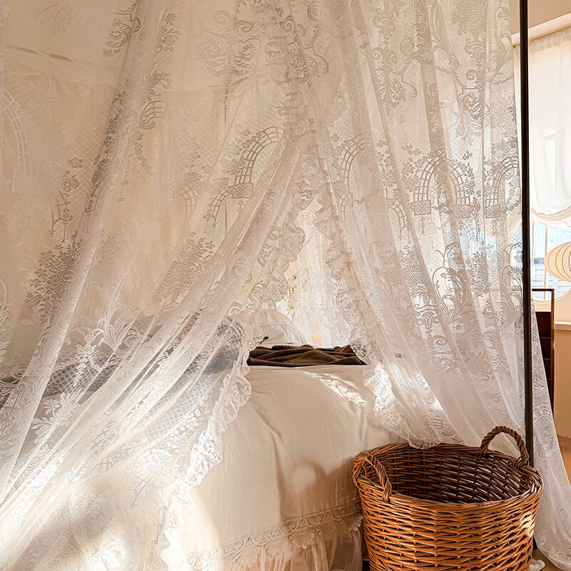 Lace curtain with intricate patterns in a softly lit room.