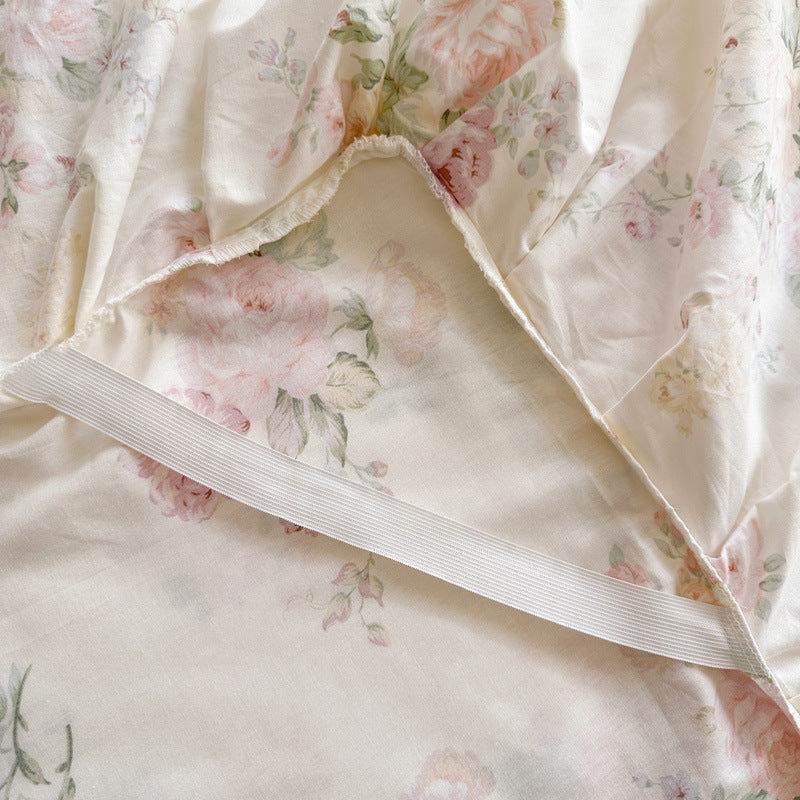 Floral patterned fabric with a strip of white ribbon on a light background