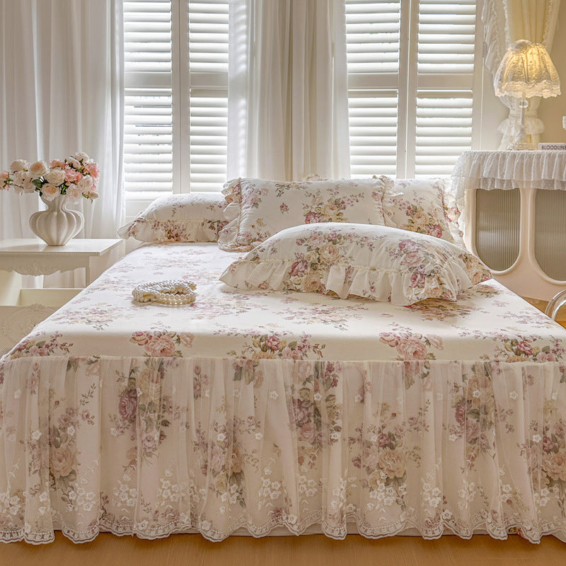 Floral bedding set on a bed in a bedroom with light decor