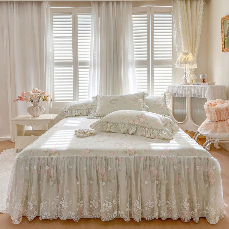 Neatly made bed with floral bedding in a bright bedroom
