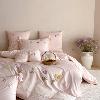 Blush pink floral bedding set with long-staple cotton fabric, raised embroidery, and soft feminine bedroom decor