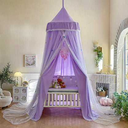 Lavender Purple kids bed canopy with pom-pom trim and double layer draped design, set up over a white baby crib, perfect for a whimsical nursery room.