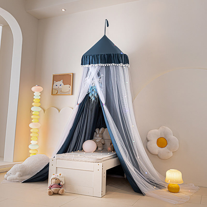 Dark Blue / Navy children's hanging bed canopy tent with white pom-pom trim, an elegant option for a teepee or reading corner in a modern nursery, featuring a deep blue inner fabric.