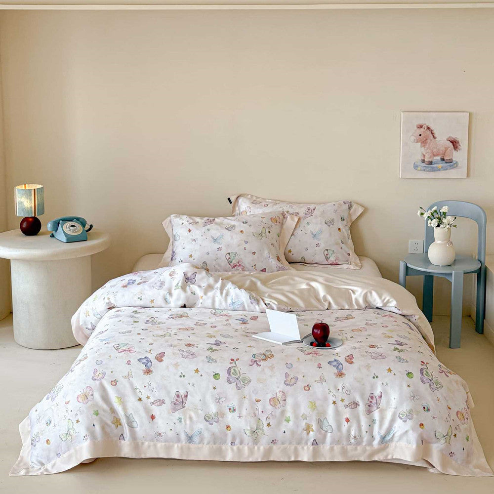 Frontal view of the Winifred Home luxury butterfly bedding in champagne, featuring a clean minimalist bedroom aesthetic with a blue side chair and elegant floral decor.