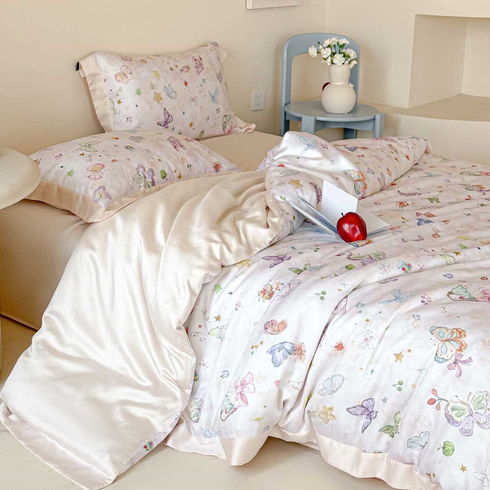 Winifred Home luxury champagne-colored Lyocell bedding set featuring whimsical butterfly and watercolor motifs, elegantly displayed on a bed with matching pillowcases and a cozy bedroom setup.