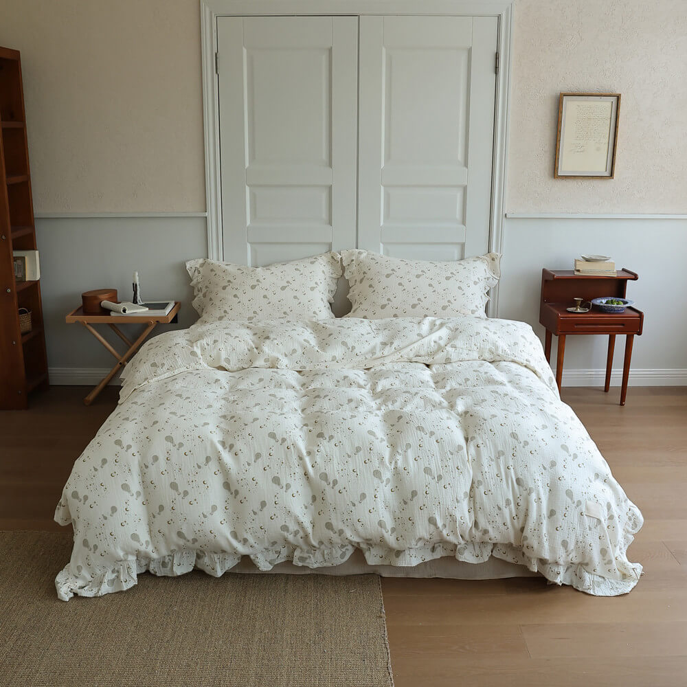 Full bed view of Moon Balloon Duvet Cover Set with soft ivory cotton muslin and ruffled edges