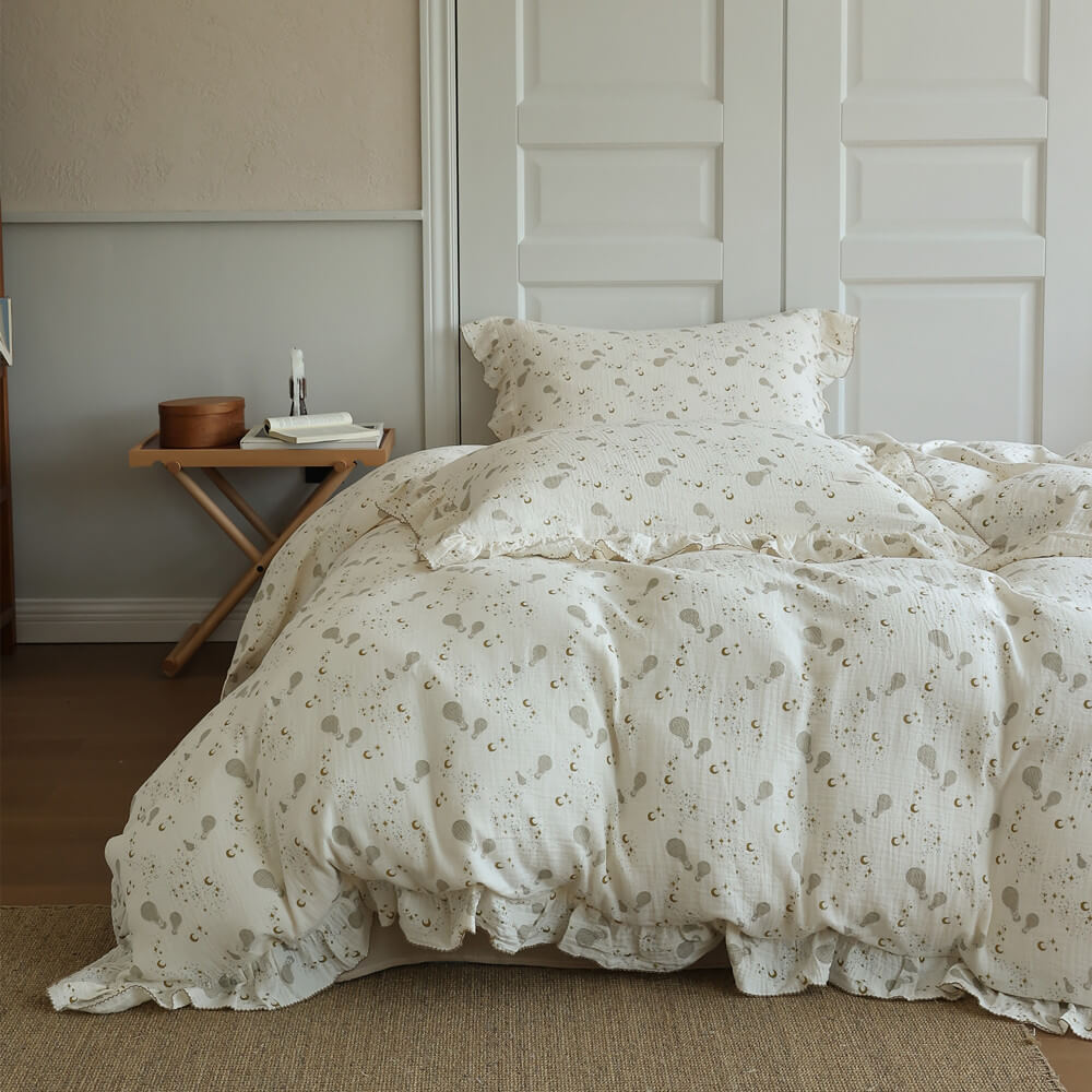Ruffled cotton muslin duvet cover with moon, star, and hot air balloon print for a dreamy teen bedroom