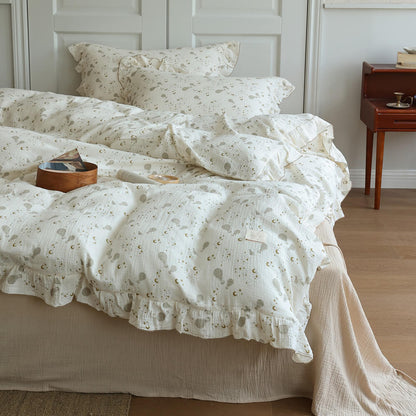Moon Balloon duvet cover and pillowcases shown with matching ruffled cotton muslin details