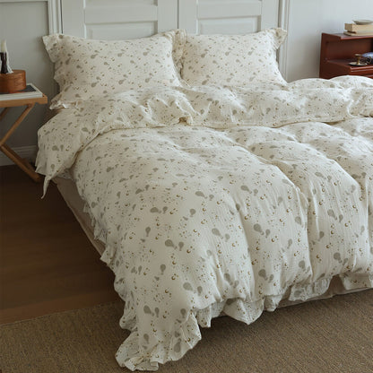 Dreamy teen bedroom styled with ivory moon balloon bedding, soft neutral decor, and cotton muslin texture